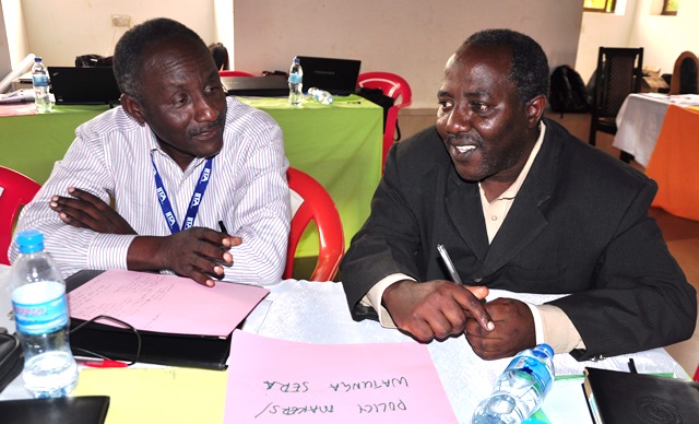 Dr Lymo (left) discussing with a fellow policy maker on how they will support the R4D platform 