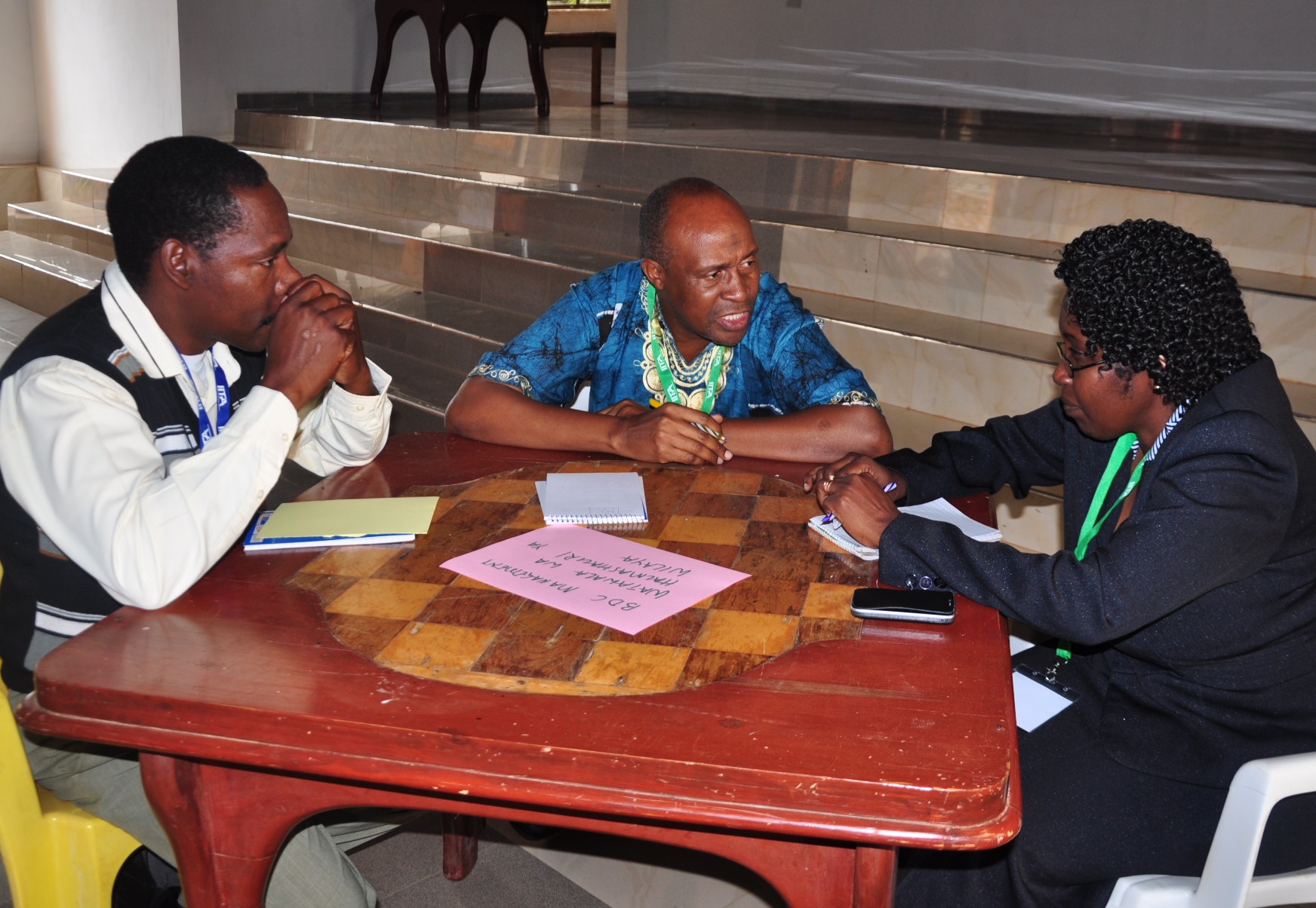 Hassan Lugendo (middle) and other representatives of the Babati District Management discussing issues of concern that they will tackle through the platform